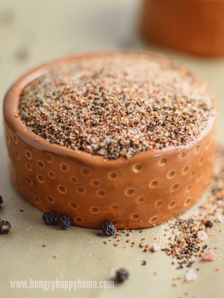 homemade steak seasoning: chili steak rub in a small clay bowl