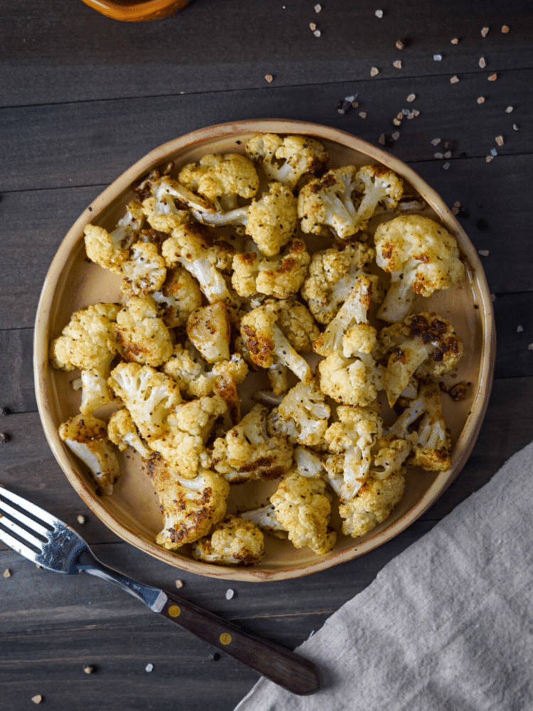 Cumin Roasted Cauliflower on a handmade ceramic plate.