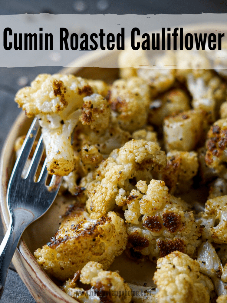 Cumin roasted cauliflower on a handmade clay plate.