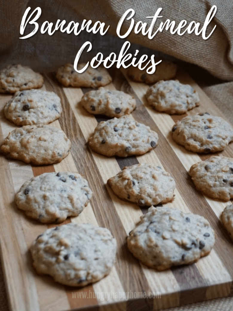 Baked banana oatmeal cookies displayed on a walnut board.