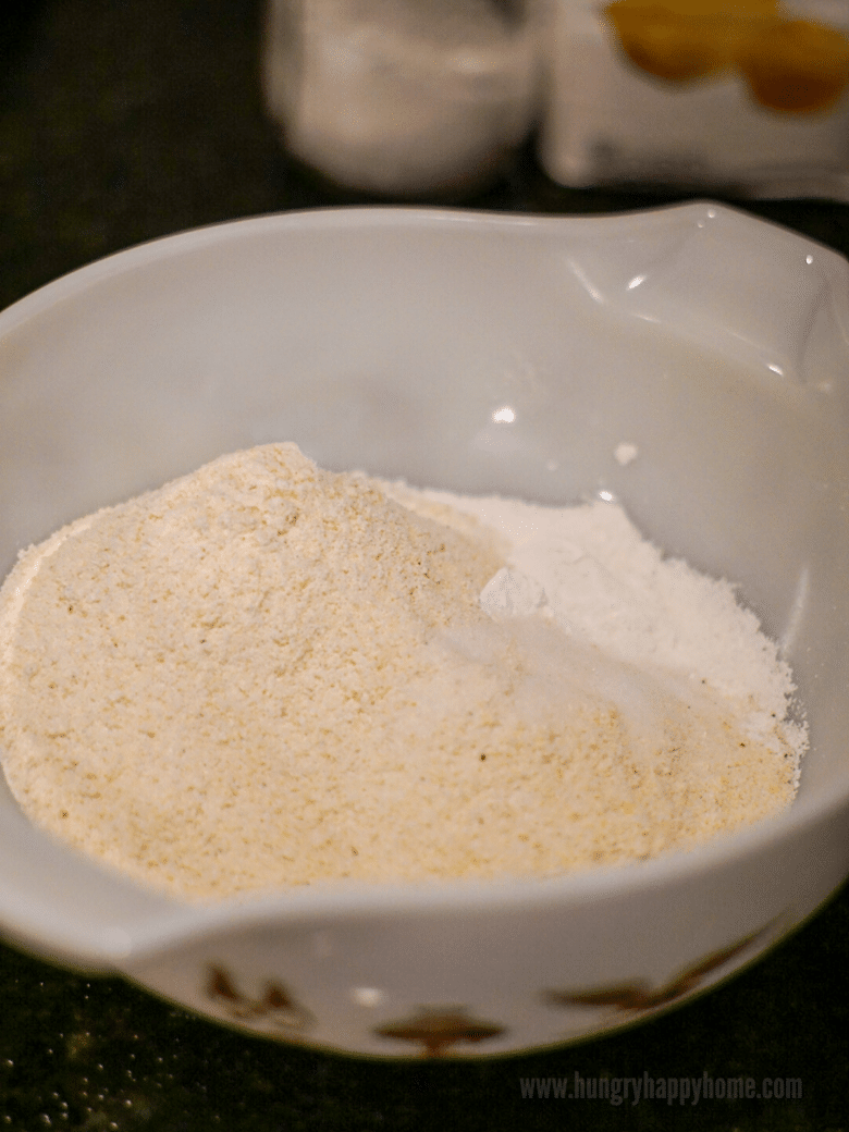 A white bowl with the reciepes dry ingredients.