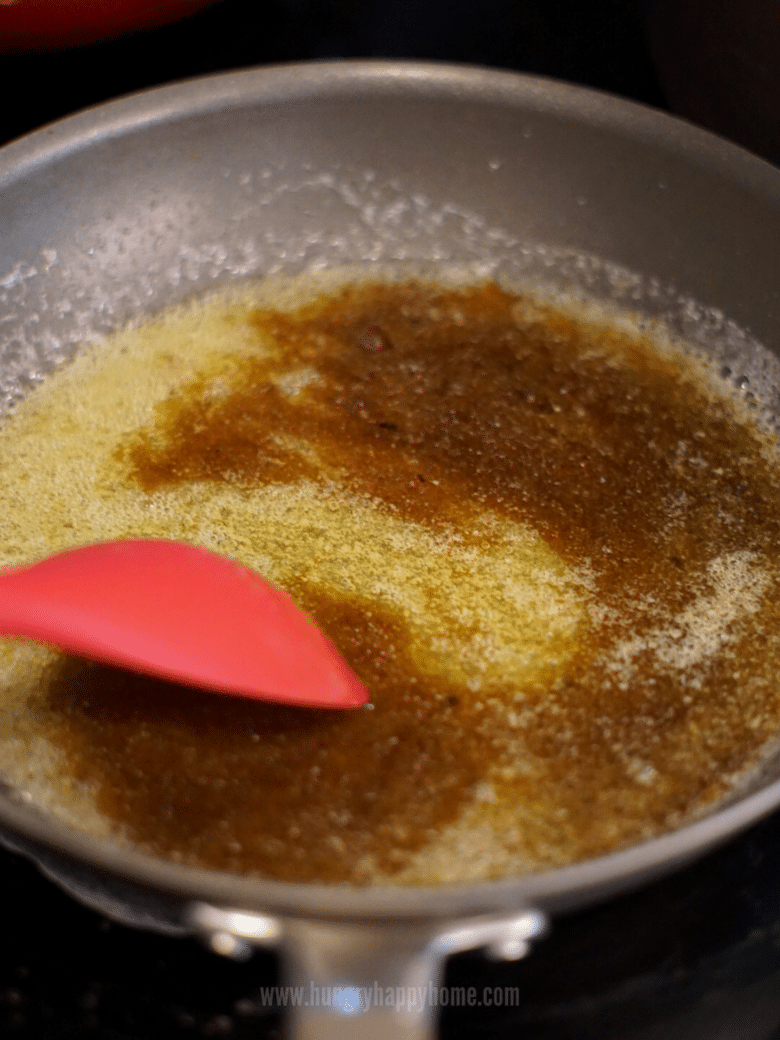 Melting butter, honey and brown sugar in a pan on the stove.