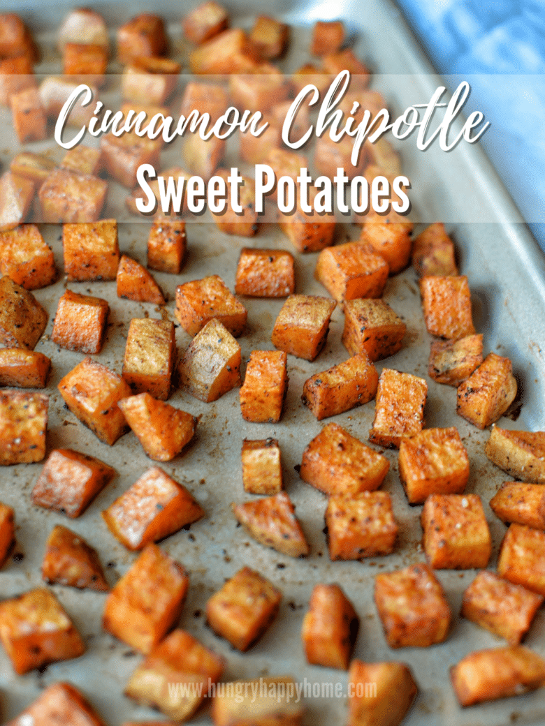 Cubed roasted cinnamon chipotle sweet potatoes on a baking dish.