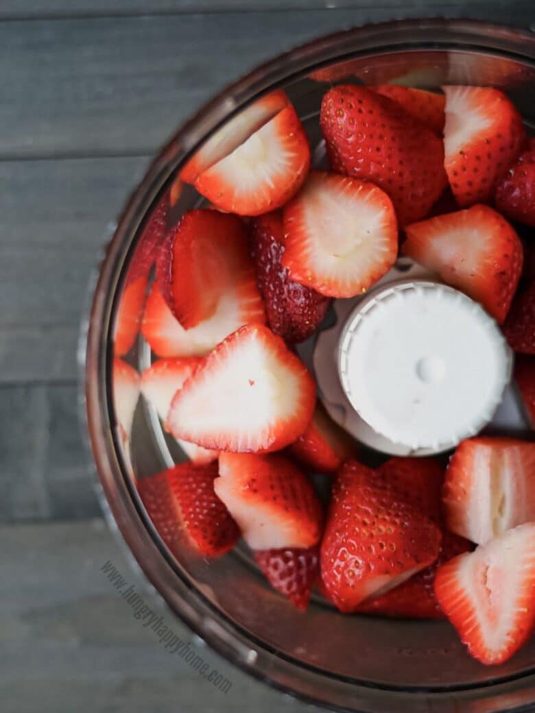 Cut strawberries in a food processor.